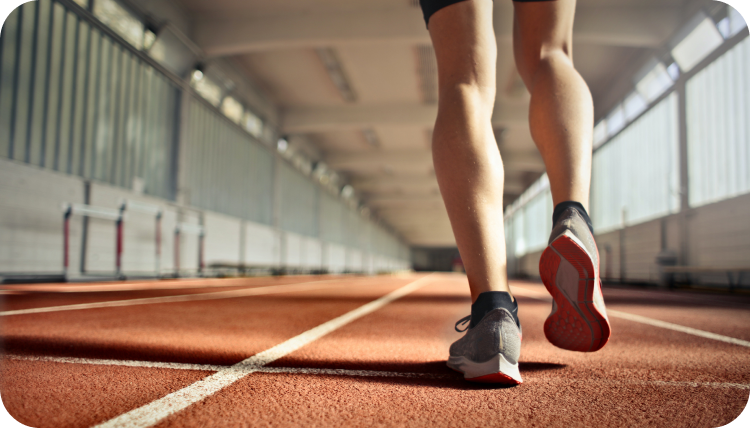 A close up of a person running on a track